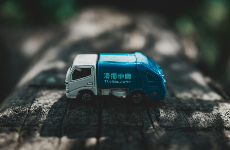 toy car on wooden surface in park