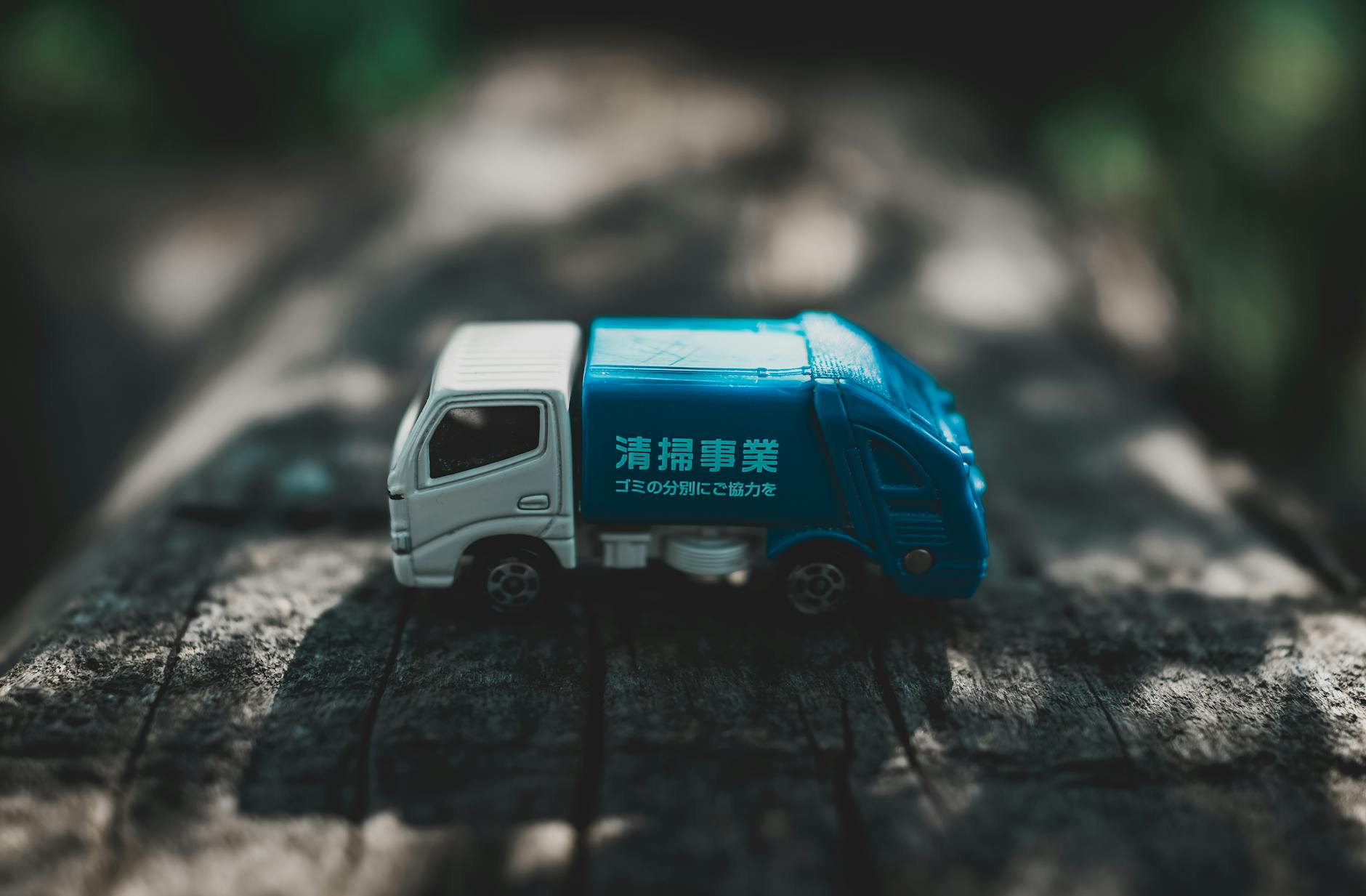 toy car on wooden surface in park